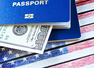 Hundred dollars and two blue passports. Immigration to the United States concept