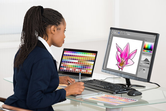 Designer Editing Photos On Computer