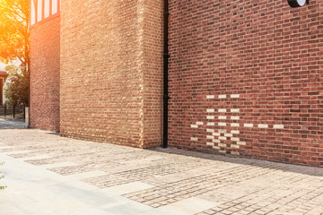 Red brick wall and empty floor sidewalk