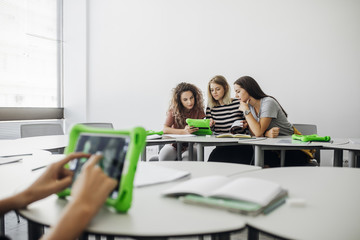 Wall Mural - High School Students Using Tablets in Round Classroom