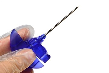 Bone marrow biopsy disposable needle with front element connected with tube rotated against the base with needle, held in doctor left hand in sterile latex glove, white background