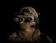 Soldier in military uniform with night vision goggles on background of dark wall 21