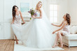© LIGHTFIELD STUDIOS - bride with bridesmaids preparing for ceremony