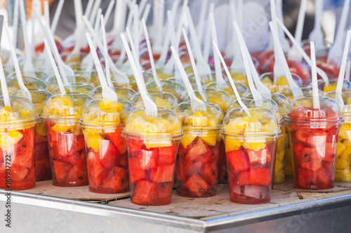 Sliced Fresh Fruits Sorted In Plastic Cups With Forks Stock Photo Adobe Stock