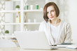 © peshkova - Caucasian business woman working on project