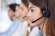 © rogerphoto - Call center operator.Young beautiful business woman in headset