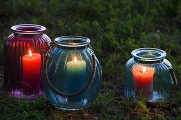 Beautiful outdoor candlestick. Color big glass lighting for garden decor.