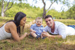 © Louis-Paul Photo - Happy Family Having fun with baby playing In The Park.