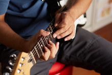 Close Up Of A Lefty Electric Guitar Being Played