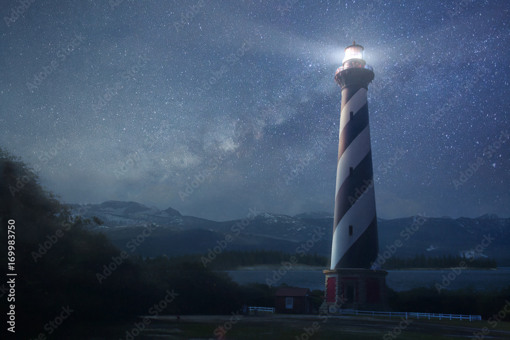 A lighthouse under night sky - obrazy, fototapety, plakaty 