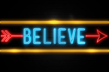 Believe  - Fluorescent Neon Sign On Brickwall Front View