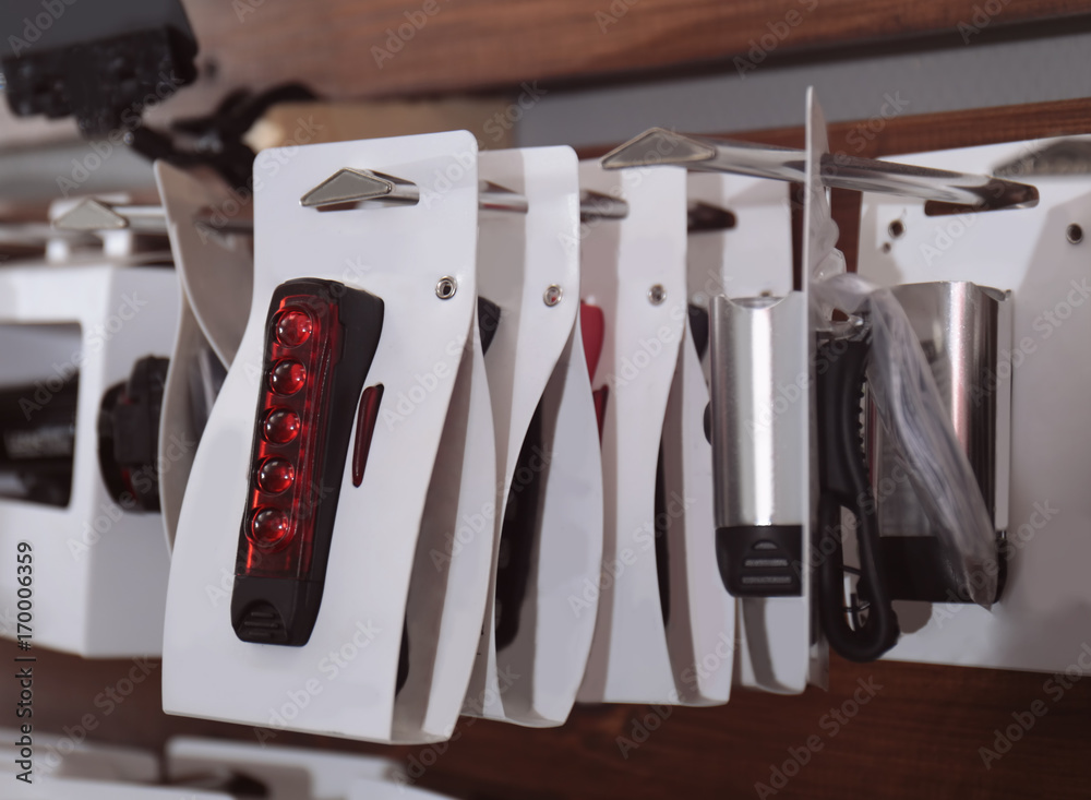 Stand with accessories for bicycle in shop