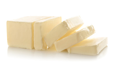 Fototapete - Cut block of butter isolated on white