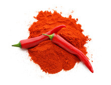 Pile Of Red Chili Powder With Whole Pepper Pods Isolated On White