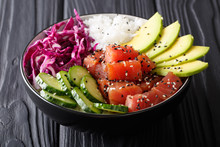 Organic Food: Tuna Poke Bowl With Rice, Fresh Cucumbers, Red Cabbage And Avocado Close-up. Horizontal