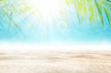 Poster - blur beautiful nature green palm leaf on tropical beach with bokeh sun light wave abstract backgroun
