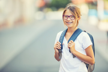 schoolgirl with bag, backpack. portrait of modern happy teen school girl with bag backpack. girl wit