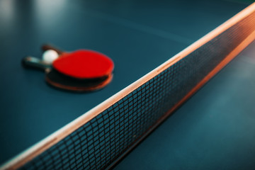 Tennis rackets and ball on the table, game concept