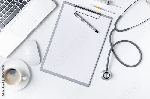 Fotografía Top view of doctor desk table with stethoscope