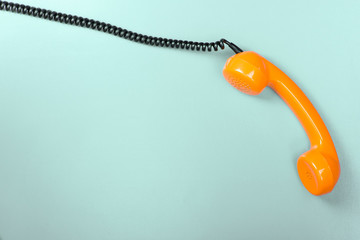 Vintage handset on a blue background. Top view.