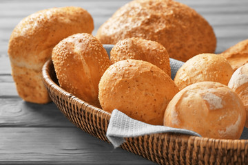 Sticker - Wicker basket and delicious bread on wooden table