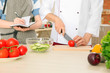 © Africa Studio - Chef giving cooking classes in kitchen