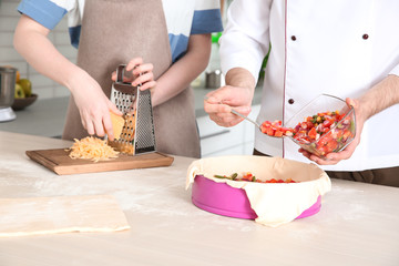 Poster - Chef giving cooking classes in kitchen