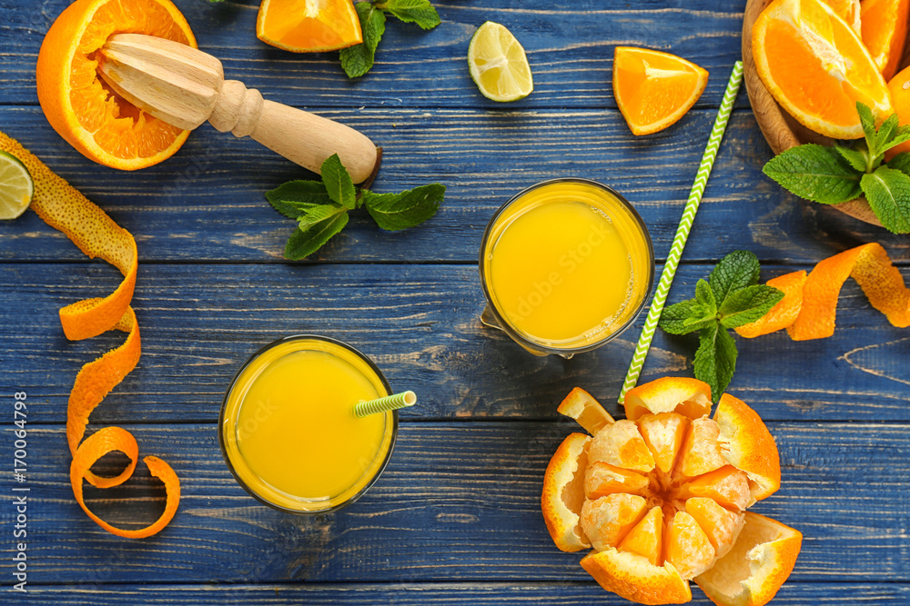 Composition with delicious orange juice on wooden table