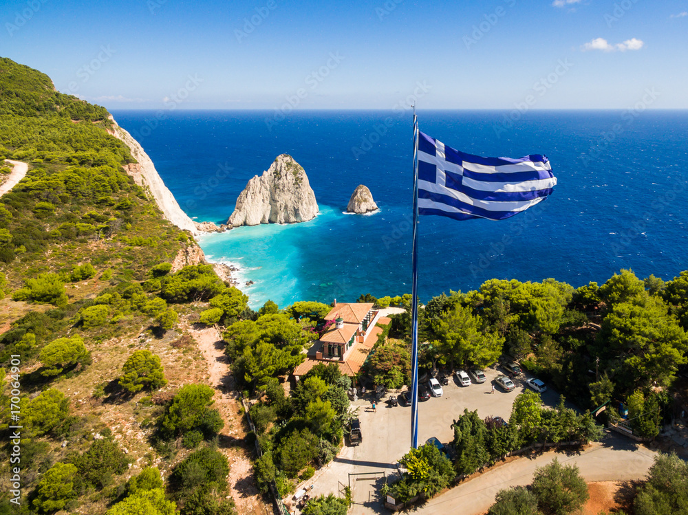 Obraz na płótnie Greek biggest national flag waving in the sky in Keri in Zakynthos (Zante) island in Greece w salonie