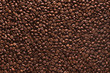 © ktsdesign - Roasted coffee beans on a flat background.