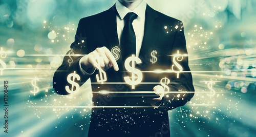 Cuadros en Lienzo Dollars with man holding a tablet computer