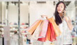 © sopradit - women holding shopping bags and cradit card in her hand