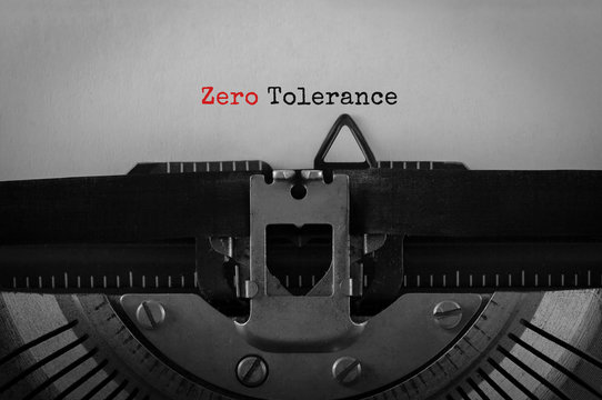 Text Zero Tolerance typed on retro typewriter