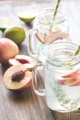 Poster - Glass jar of lime water with slices of peach