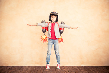 Kid with jet pack playing at home