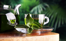Cups Of Tea With Mint On Wooden Table