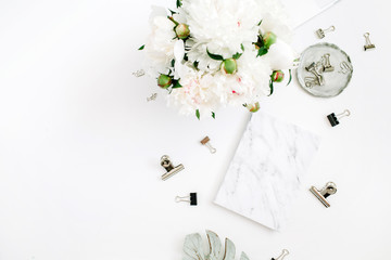 Wall Mural - Flat lay home office desk. Woman workspace with white peony flowers bouquet, accessories, marble diary on white background. Top view feminine background.