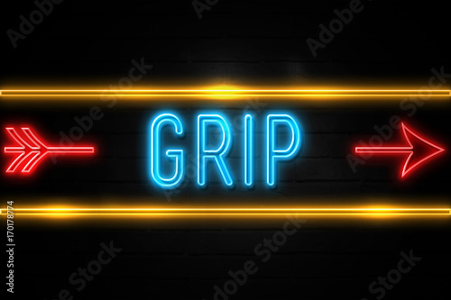 Fotografija  Grip  - fluorescent Neon Sign on brickwall Front view