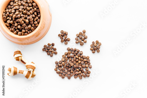 Download Large Bowl Of Pet Dog Food Spilling In Paw Print On White Background Top View Mockup Stock Photo Adobe Stock