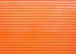 An orange metal door