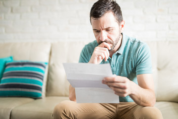 Latin man reading correspondence