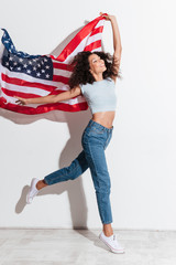 Sticker - Happy funny woman jumping with american flag