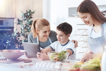 Wall Mural - Happy family gathering together in kitchen