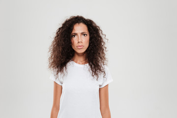 Sticker - Young curly woman looking at the camera