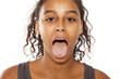 beautiful dark skinned girl with open mouth and tongue out on white background