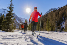 A Family Group Of Cross Country Skiers On A Sunny Winter Morning In Italy Alps, South Tirol, Solda.
