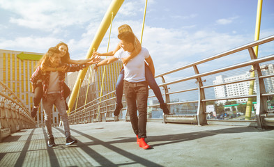 Wall Mural - Two couples friends having fun and walking in the city