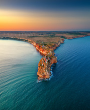 Aerial Sunset View Over Cape Kaliakra With Windmills Farm, Huge Cliffs On Black Sea Coast In Bulgaria