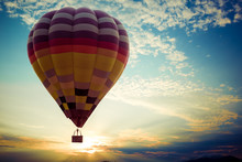 Colorful Hot Air Balloon Flying On Sky At Sunset. Travel And Air Transportation Concept - Vintage And Retro Filter Effect Style