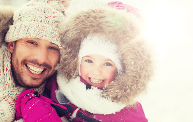 Wall Mural - happy family in winter clothes outdoors